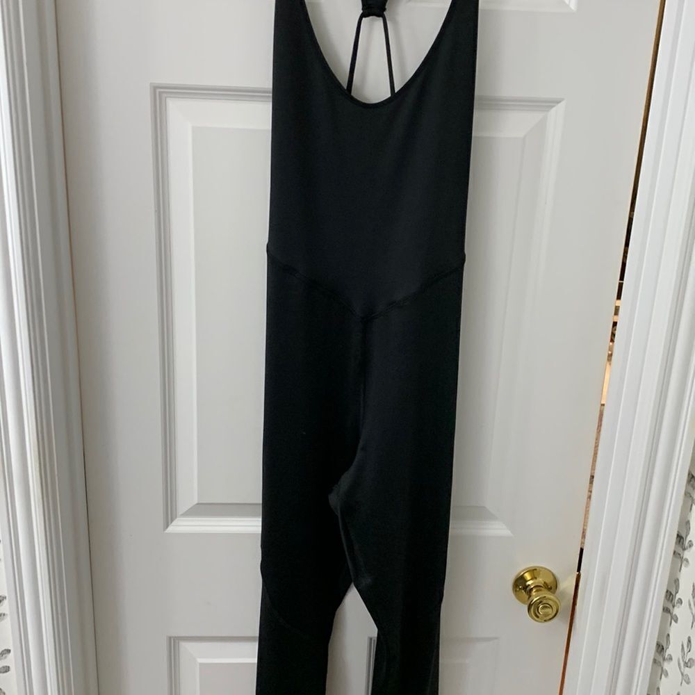 Forever 21 Size Large one piece strappy jumpsuit/romper with tummy control